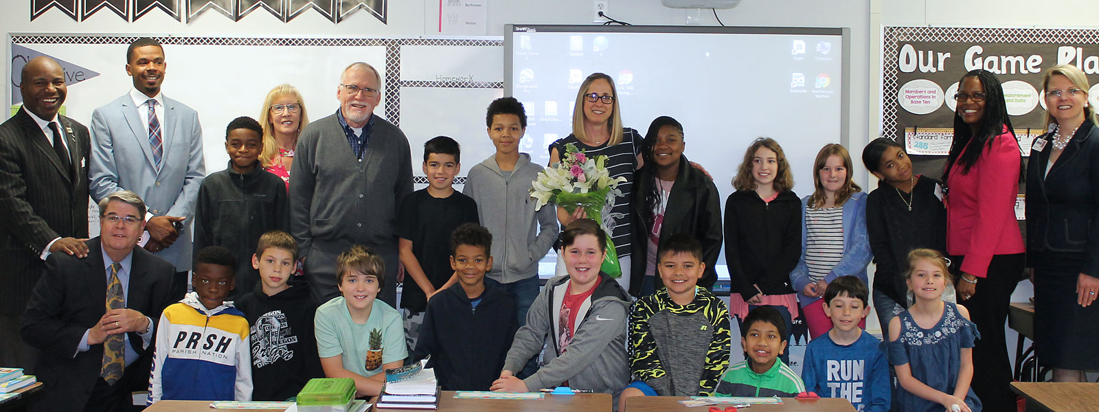 Teacher of the Year, Mrs. Tkacik, with students and administrators