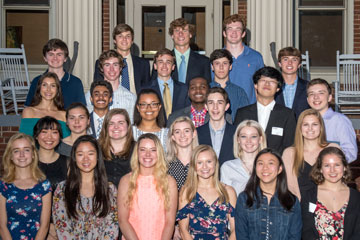 Group of senior honors recipients standing on stairs