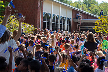 Principal on roof making announcement to school