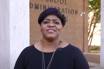 Ethel Reeves standing outside School Administration Building