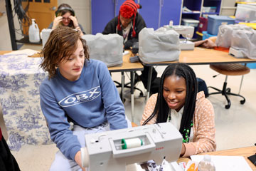 Students sewing during club meeting