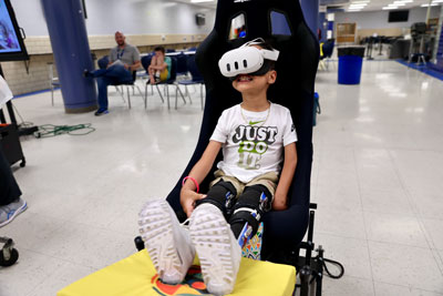 Student in chair with VR headset