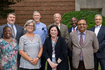 School board members standing outside