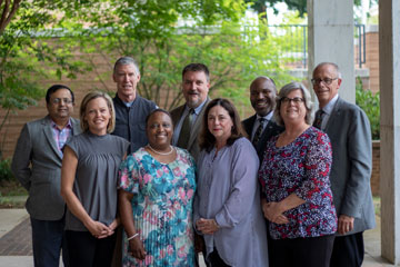 School Board members standing outside