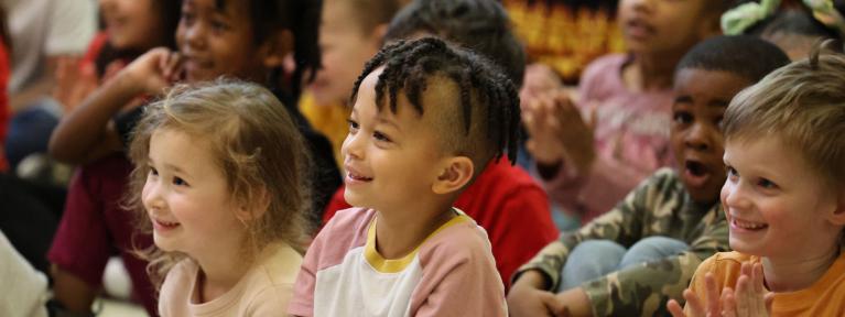 Smiling students during school assembly