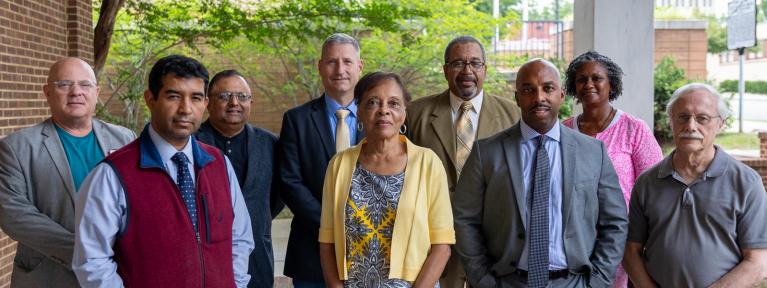 School board members standing outside